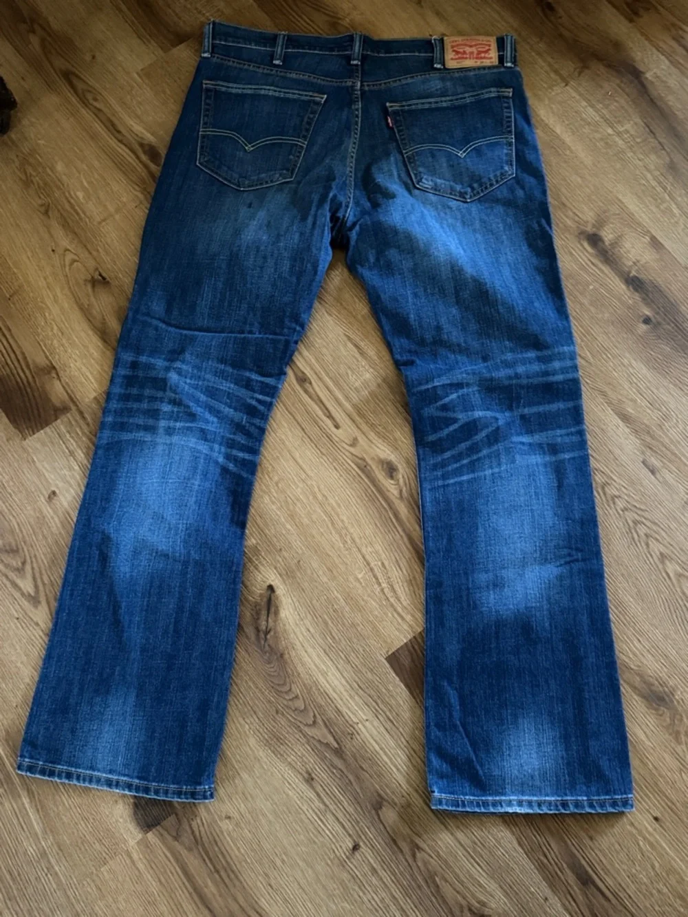 Levi's Blue Bootcut Jeans with Faded Whiskering 527
